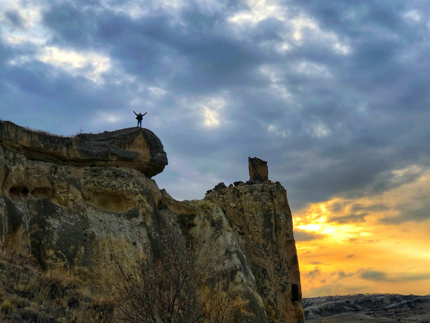 A traveller overlooking Cappadocia at sunset