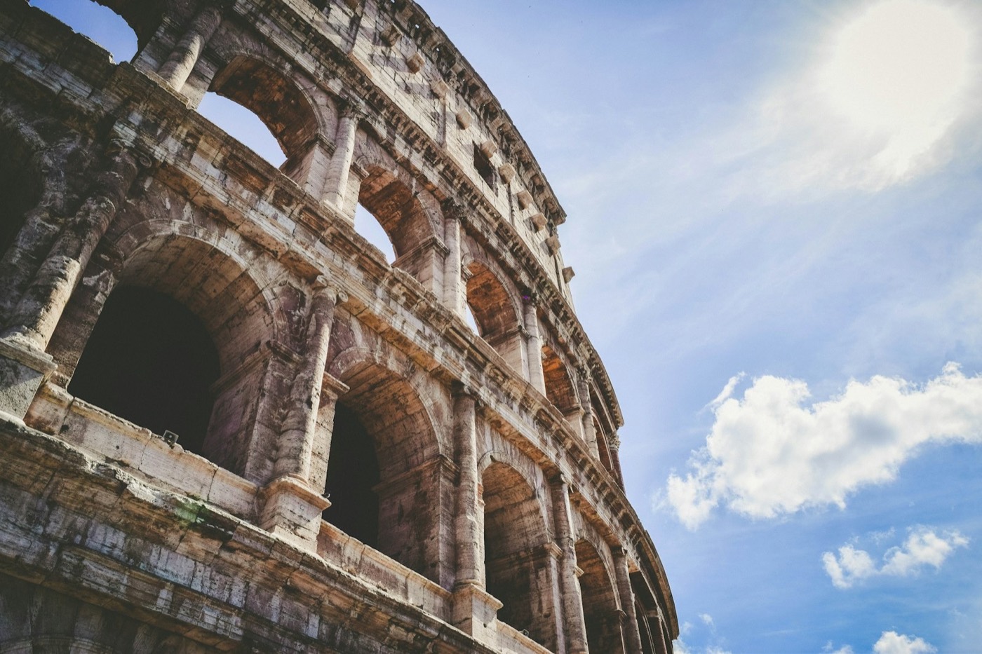 The arches of the Colosseum seen from street level in Rome